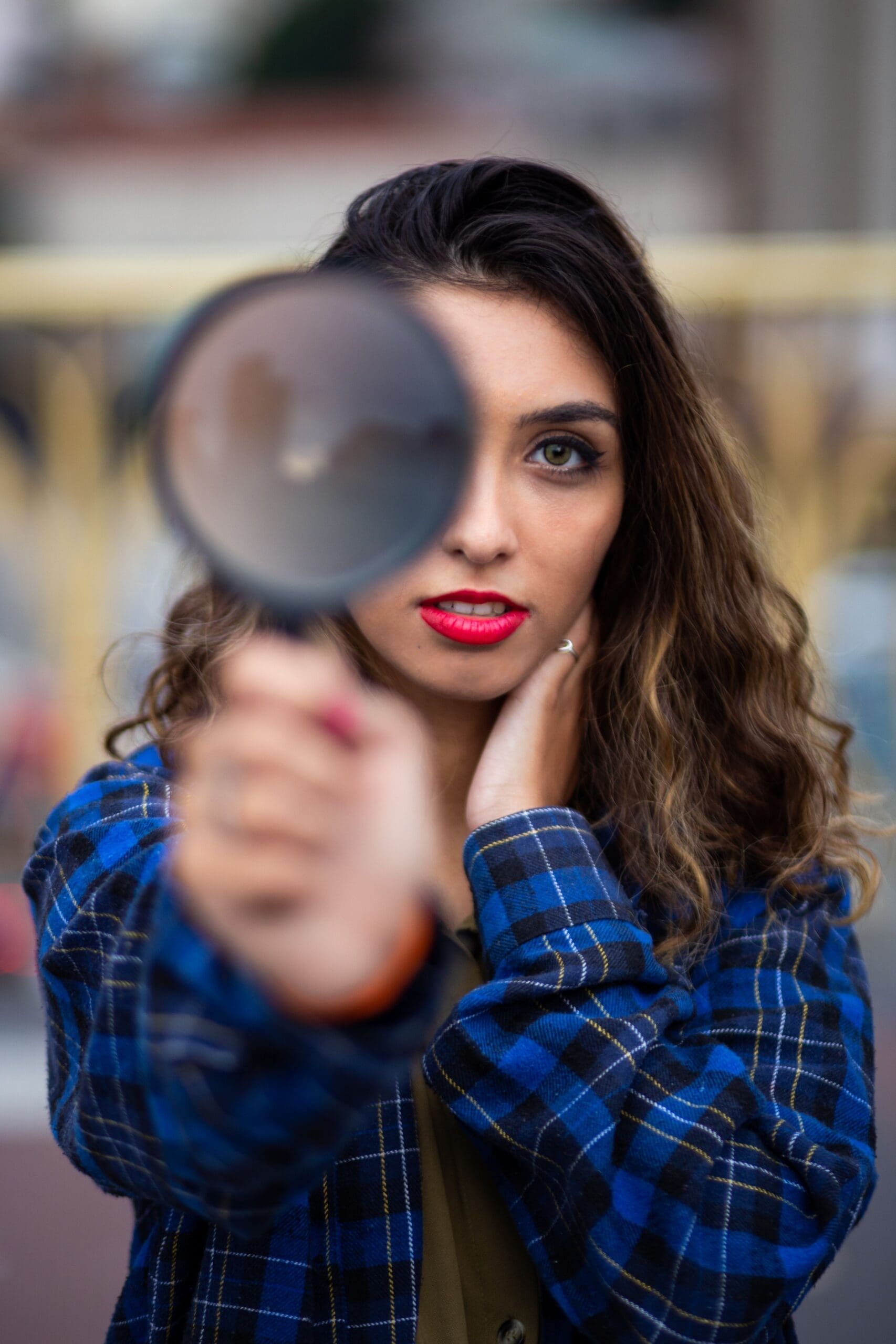 Woman holding up magnifying glass